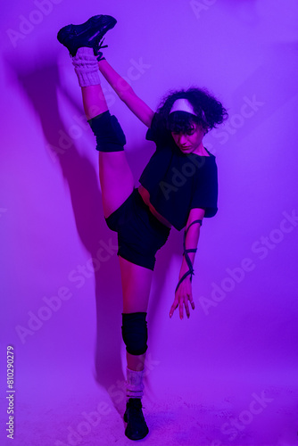 Sporty young woman stretching and doing yoga exercises. Young woman doing dance figures on white background