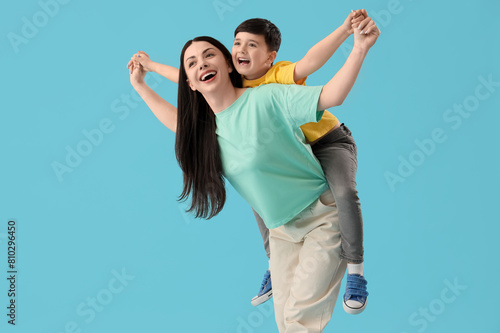 Mother holding her little s...