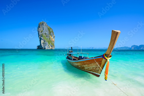 Traditional thai longtail boat on tropical beach
