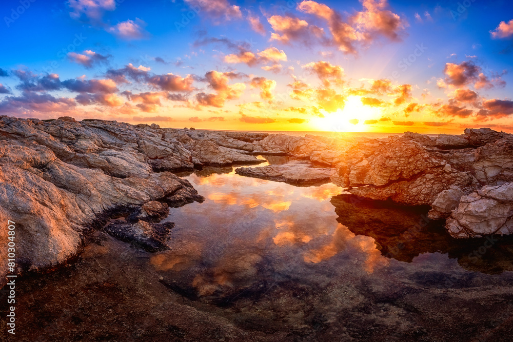 Majestic sunset over coastal rock pools