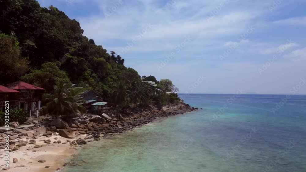 Island Cabins in lush fores, emerald waters bay. Best aerial view flight drone Island Cabins in lush fores, emerald waters bay. Best aerial view flight drone