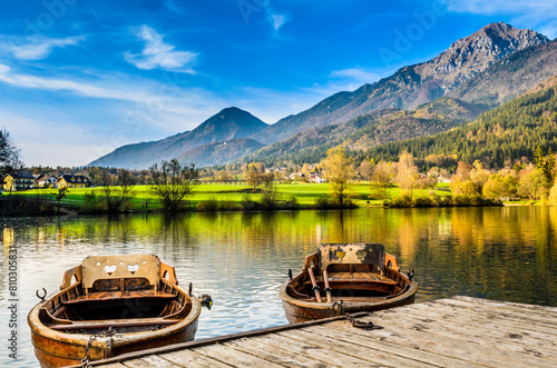 Serene lakeside view with rowboats photo