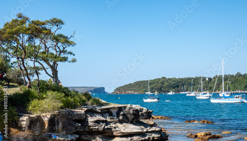 Sydney Harbour, taken from Balmoral Beach. Sailing boats and yachts on a bright clear day. NSW, Australia.
