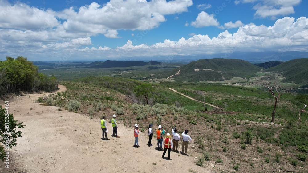 Obraz premium Engineers watching lands for renewable energy development 