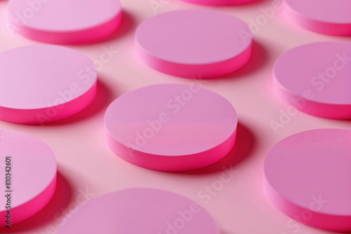 Multiple pink round podiums on a pink surface. Abstract and minimalist design for versatile product displays and contemporary marketing visuals