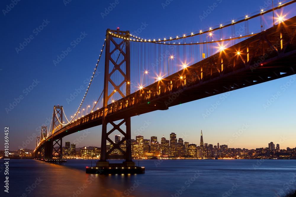 Majestic evening skyline and illuminated bridge