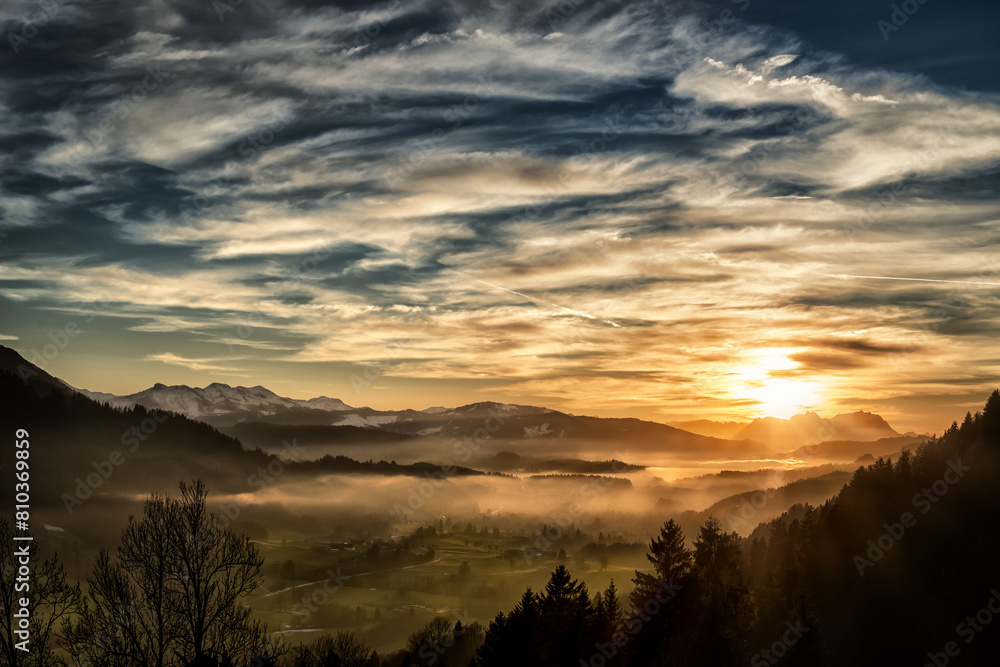 Majestic mountain sunrise with misty valleys