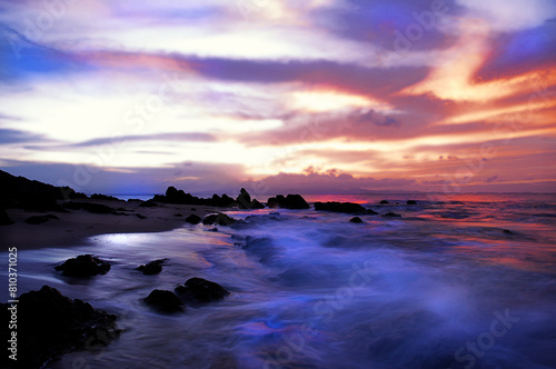 Majestic sunset at rocky beach © Bryan