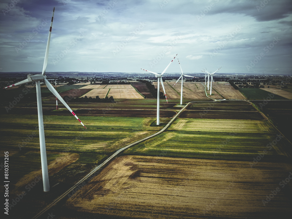 Aerial view of wind turbines in agricultural landscape