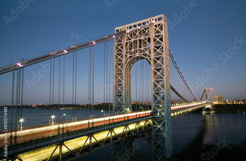 Twilight over urban suspension bridge photo