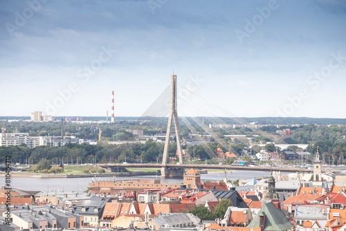 Panorama of the Daugava river in Riga, latvia, with a focus on Vansu tilts, or vansu bridge, in front of old riga. Riga is the capital city of Latvia, Vansu is a cable stayed bridge. photo
