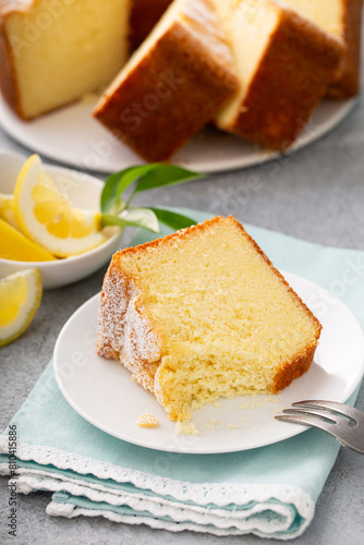 Lemon pound cake baked in a bundt pan topped with powdered sugar