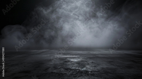 Abstract image of dark room concrete floor. Black room or stage background for product placement.Panoramic view of the abstract fog. White cloudiness, mist or smog moves on black background.