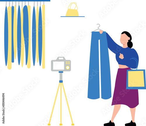 The girl is making promotional videos for clothes.