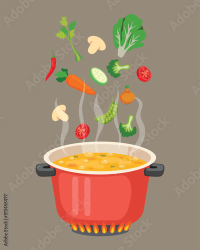 Boiled vegetables soup in pot on the stove as cooking concept