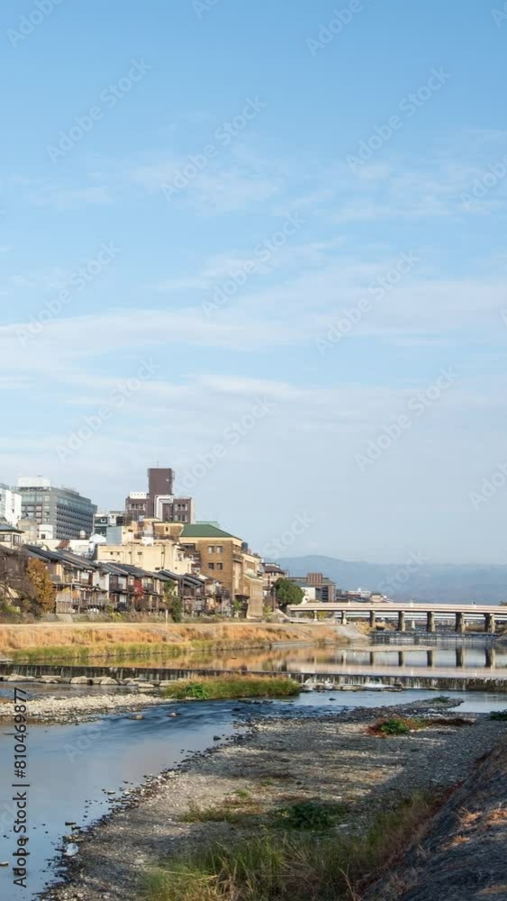 Cityscape skyline vertical time lapse video at Kamo river in a morning, Kyoto city, Japan. Cityscape skyline vertical time lapse video at Kamo river in a morning, Kyoto city, Japan.