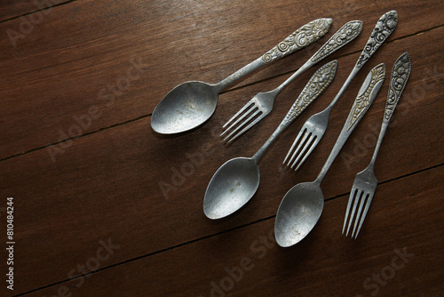 Three pairs of old silver cutlery with different classic carved ornaments on the handles