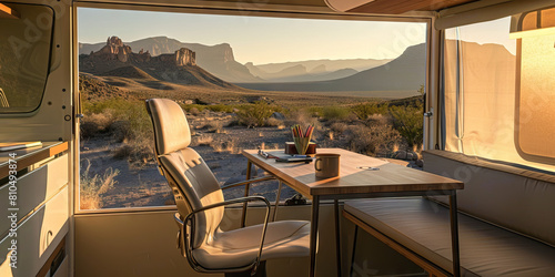 Big Bend Beauty: A minimalist desk set up in a serene, modern camper at Big Bend National Park, overlooking the stunning Chihuahuan Desert landscape