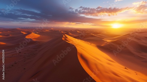 Desert Sunset: Aerial View of Sand Dunes Glowing in the Evening Light