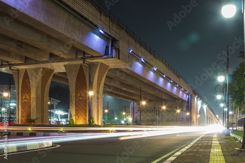 View of night traffic on Purwosari flyover with light lamps and light trails. Located on Purwosari, Surakarta  photo