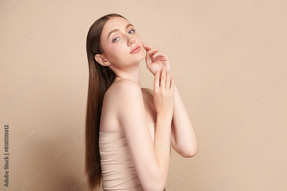 Beautiful young woman with clean fresh skin on beige background, Face care, Facial treatment, Cosmetology, beauty and spa, women portrait. Beautiful young woman with clean fresh skin on beige background, Face care, Facial treatment, Cosmetology, beauty and spa, women portrait.