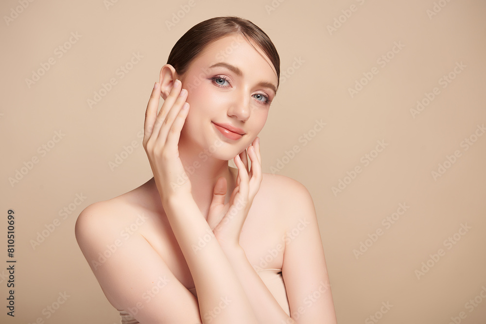 Beautiful young woman with clean fresh skin on beige background, Face care, Facial treatment, Cosmetology, beauty and spa, women portrait. Beautiful young woman with clean fresh skin on beige background, Face care, Facial treatment, Cosmetology, beauty and spa, women portrait.