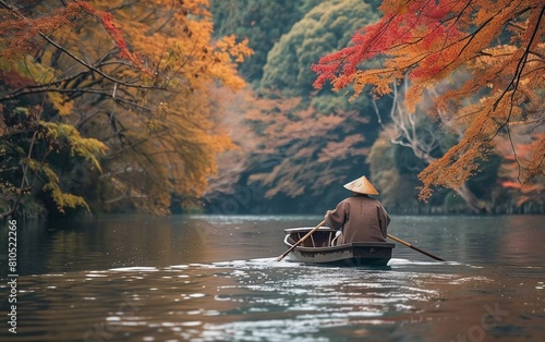 The boatman rows the boat on the river. Arashiyama in autumn along the river in Kyoto, Japan, very beautiful view photo