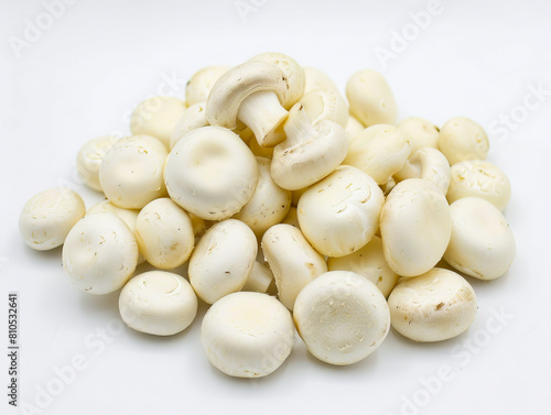 A pile of white mushrooms on a white background.