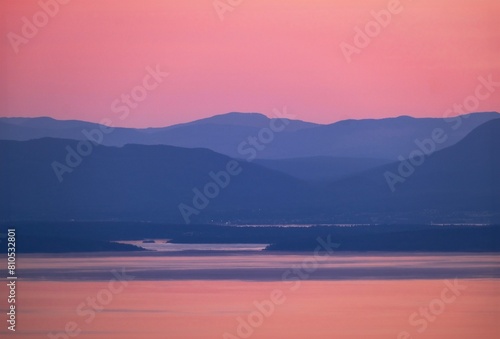 Mountains in the sea at sunset. Pink and blue landscape. Vancouver Island. British Columbia. Canada. View form the Grouse Mountain. 