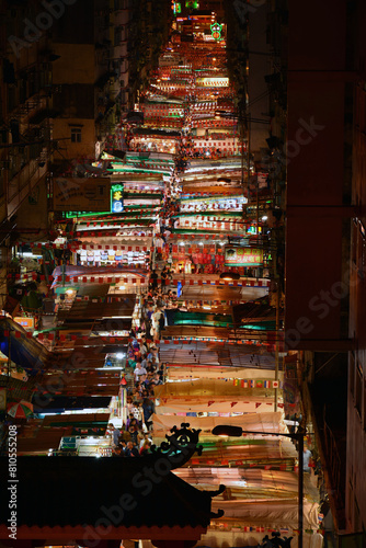 Bird view of Night Market at Temple street full of stalls in Hong Kong at night.