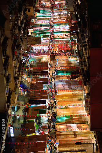 Bird view of Night Market at Temple street full of stalls in Hong Kong at night.