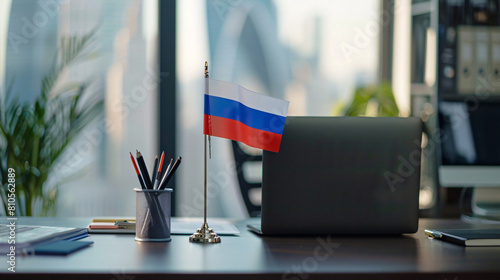 Russian flag stationery holder and laptop on table  photo