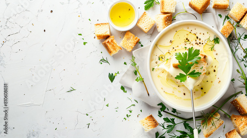 Sticks with croutons dipped into cheese fondue on ligh photo