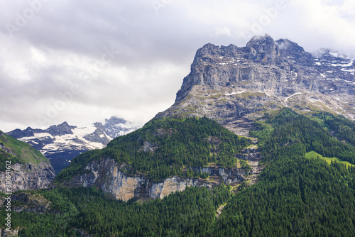 Stunning scenic view of snow mountain peaks of Alps in Switzerland. Beautiful Alps Mountain landscape, telephoto shot.