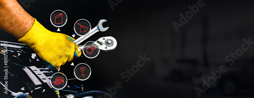 Fotografi Car maintenance and servicing concept , A mechanic hand using a wrench to fix an
