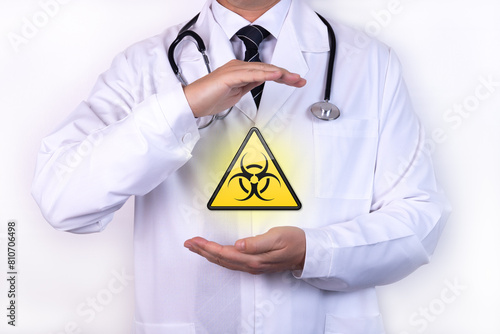 Doctor holds a sign of radiation. The concept of radiation risk.