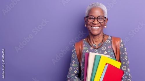 A Smiling Senior Woman with Books photo