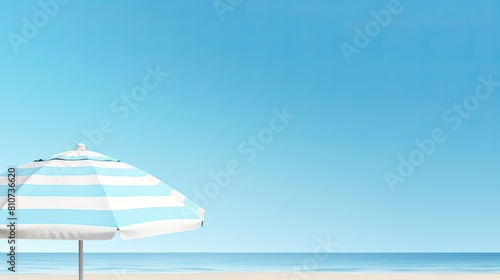 Serene landscape  beach umbrella on the shore of a calm sea on a quiet summer day.