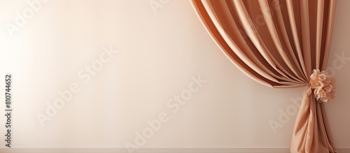 Closeup of an elegant room with a window curtain and tiebacks perfect for a copy space image photo