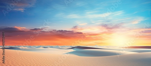 A peaceful and relaxing summer concept of a desert beach at sunset with a white sandy background and ample copy space for your image