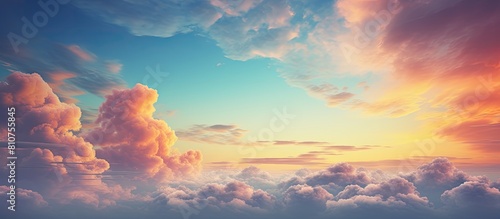 A stunning copy space image of an abstract sky with vibrant clouds illuminated by the rising or setting sun