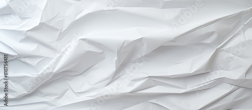 The crumpled paper has a white color texture background perfect for a copy space image