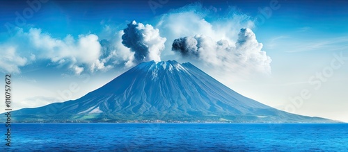 A vivid blue volcano rises from an oceanic island offering a captivating image with space for text It evokes a sense of travel and showcases the beauty of nature. Creative banner. Copyspace image