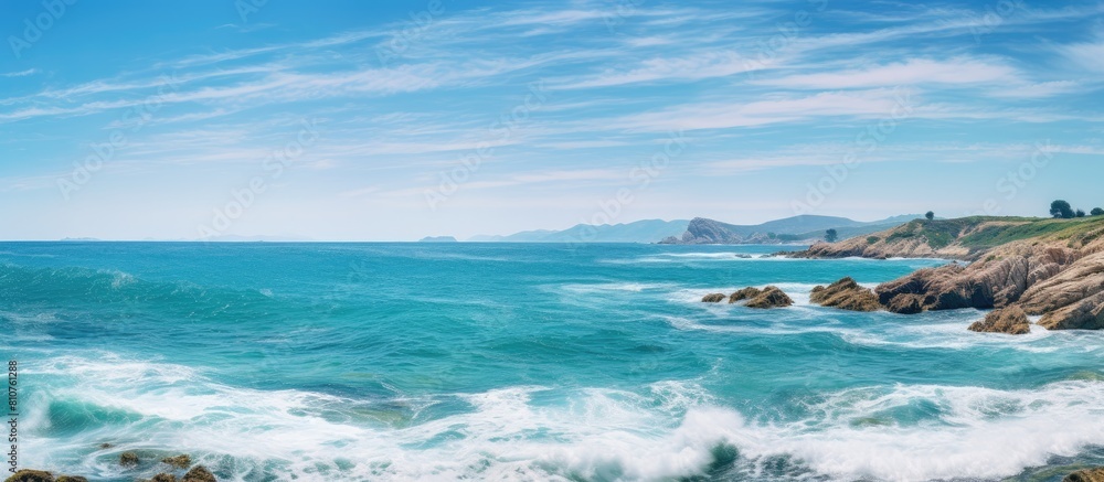A captivating image showcasing a panoramic view of the turquoise sea meeting the rugged shore providing ample copy space for the perfect visual composition