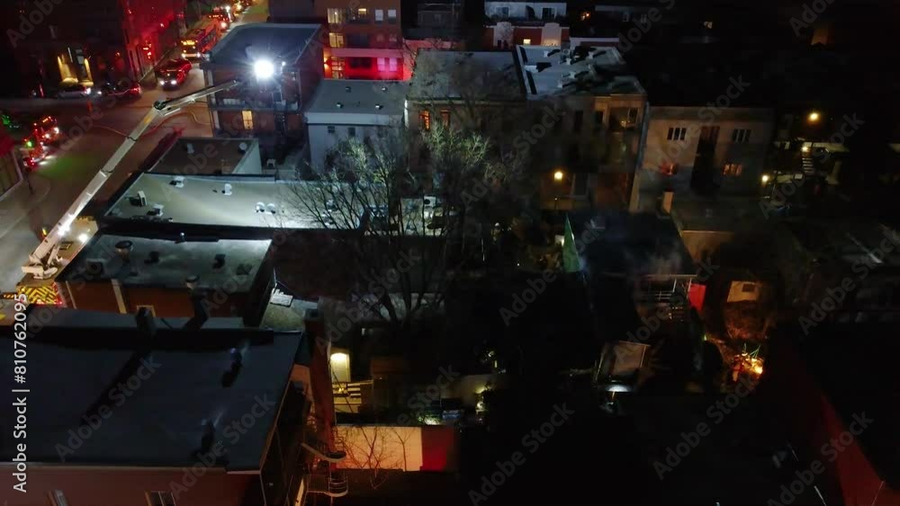 Firefighters Shine Flashlights on Scene of Urban House Fire After Dark Firefighters Shine Flashlights on Scene of Urban House Fire After Dark