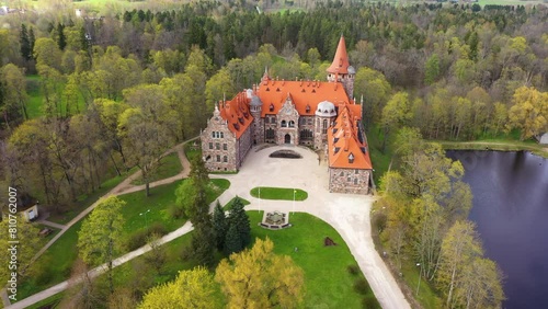 Cesvaine impressive castle next to a lake in Latvia. Aerial view photo
