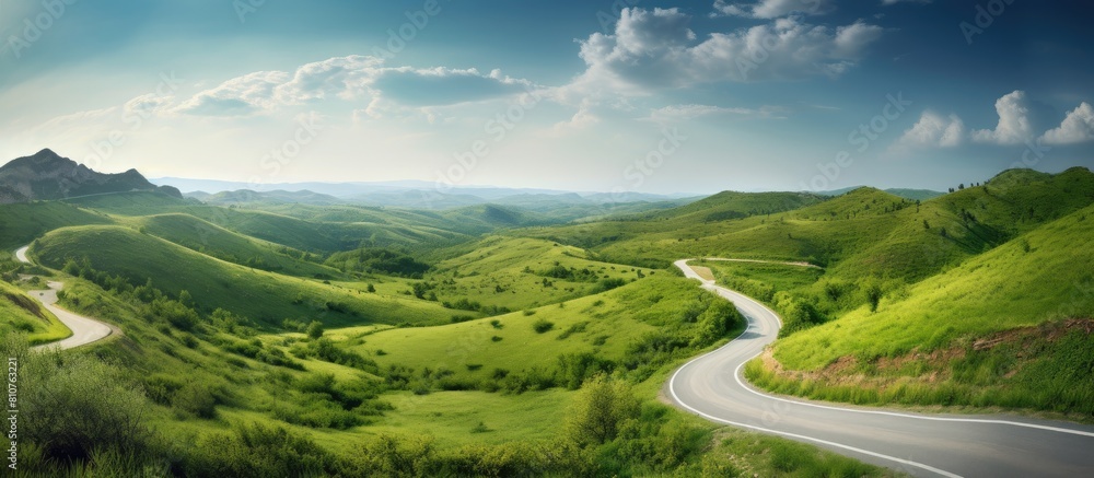 Rustic countryside road winding through a picturesque rural landscape showcasing the concept of countryside infrastructure with plenty of copy space image