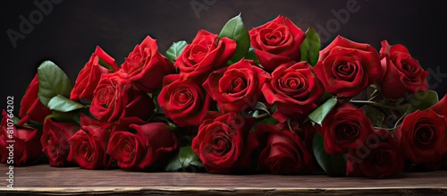 A beautiful arrangement of red roses with copy space image