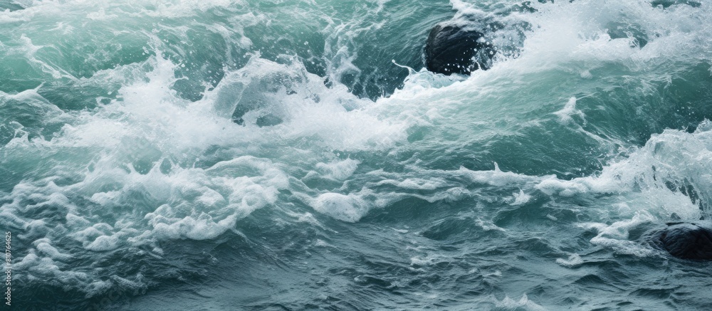 A close up copy space image of frothy water formed as a stream cascades A close up copy space image of frothy water formed as a stream cascades