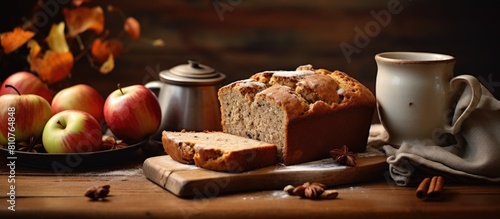 Autumn themed home bakery featuring a delectable cinnamon and apple bread Perfect for cozying up with a cup of tea or coffee Copy space image photo